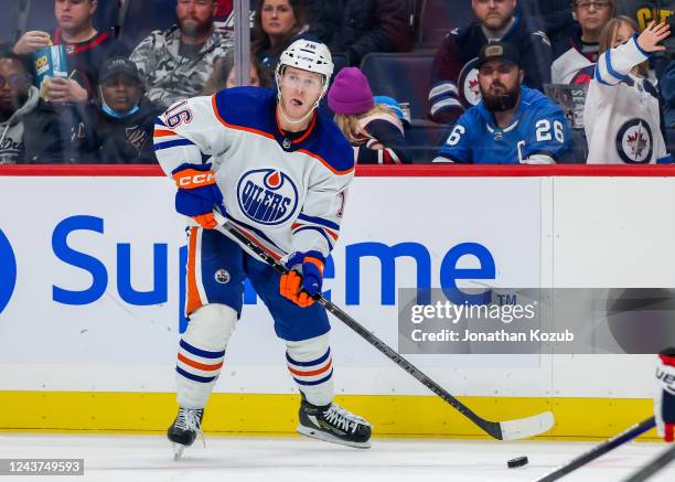 Tyler Benson of the Edmonton Oilers plays the puck during third period action against the Winnipeg Jets in a pre-season game at Canada Life Centre on...