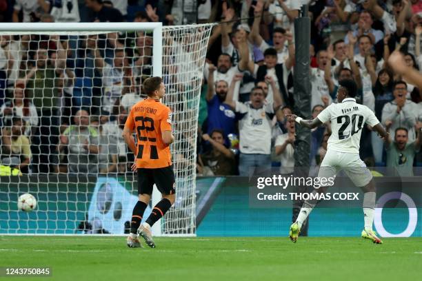 Real Madrid's Brazilian forward Vinicius Junior scores his team's second goal during the UEFA Champions League 1st round day 3 group F football match...