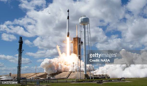 In this handout photo provided by NASA, a SpaceX Falcon 9 rocket carrying the company's Crew Dragon spacecraft is launched on NASAs SpaceX Crew-5...