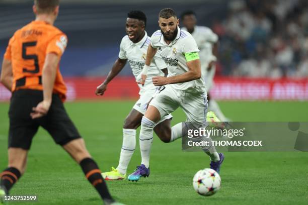 Real Madrid's French forward Karim Benzema runs with the ball during the UEFA Champions League 1st round day 3 group F football match between Real...