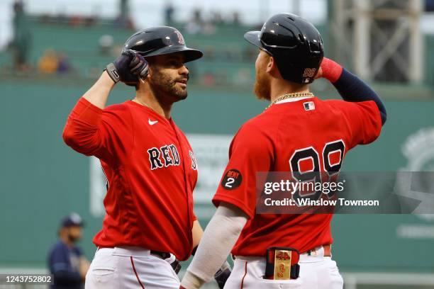 Martinez of the Boston Red Sox is greeted by teammate Alex Verdugo after his three-run home run against the Tampa Bay Rays during the first inning at...