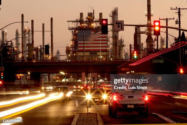 Traffic streams past the Marathon Refinery in Carson.