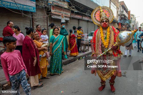 Artist dressed as Hanuman seen during a religious procession marking the Dussehra Festival. The ten-day long Hindu festival celebrates the victory of...