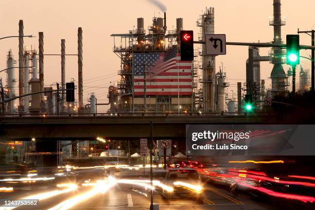 Traffic streams past the Marathon Refinery in Carson.