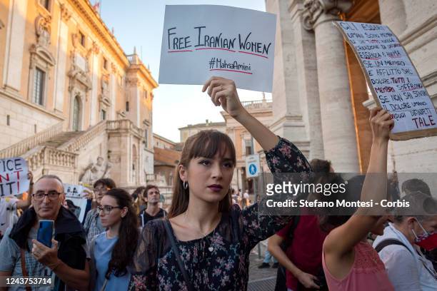 Protester hold sign during a demonstration by Amnesty International Italy in defence of Iranian women and protestors in Iran in Piazza del...