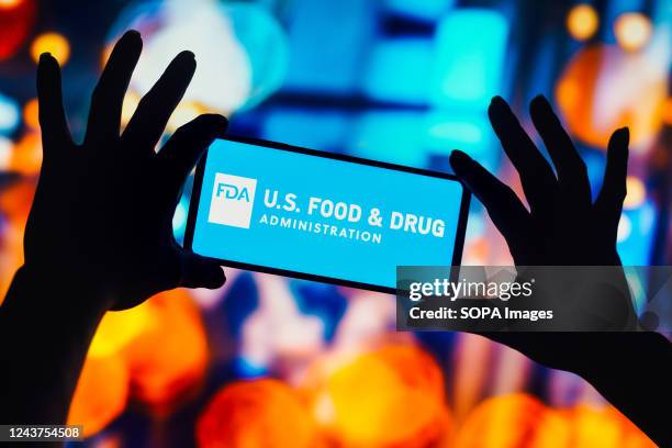In this photo illustration, the Food and Drug Administration logo is seen displayed on a smartphone.