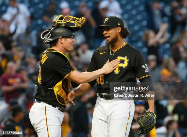 Tyler Heineman and Yohan Ramirez of the Pittsburgh Pirates celebrate after defeating the St. Louis Cardinals 5-3 during the game at PNC Park on...