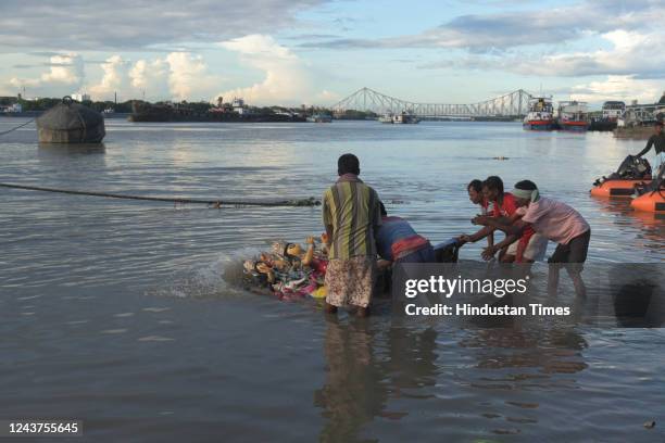 Immersion of Durga idol on the tenth/final day of Durga Puja at Babu ghat on the banks of river Hooghly on October 5, 2022 in Kolkata, India.