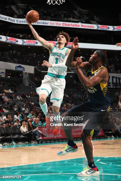LaMelo Ball of the Charlotte Hornets drives to the basket during the game against the Indiana Pacers on October 5, 2022 at Spectrum Center in...