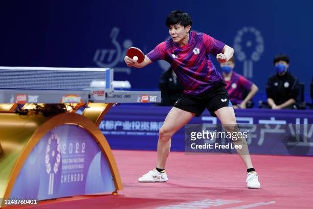Jingyi Zhou of Singapore plays a backhand against Cheng I-Ching of Chinese Taipei during 2022 ITTF World Team Championships Finals - Day 7 Women's...