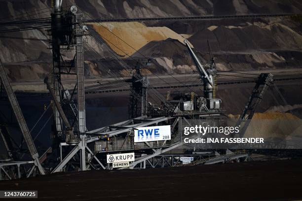 Picture taken on October 5, 2022 shows a bucket wheel excavator of German energy giant RWE at the Garzweiler lignite open cast mine near Luetzerath,...