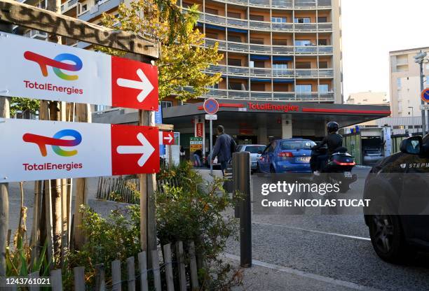 Drivers line up as they wait at a TotalEnergies fuel station in Marseille, southern France on October 06, 2022. - No general shortage, but more than...