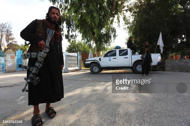 Taliban security forces stand guard along a roadside in Jalalabad on October 6, 2022.