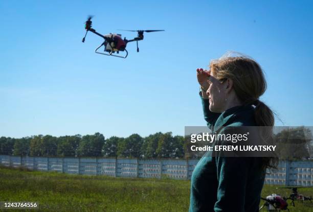 Head of the U.S. Agency for International Development Samantha Power observes drones which were received by local farmers from the USAID in outskirts...
