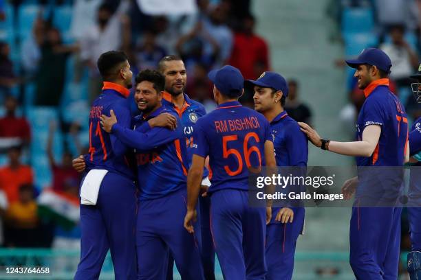 Kuldeep Yadav of India celebrates the wicket of Aiden Markram of South Africa during the 1st One Day International match between India and South...