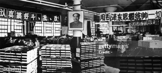 Picture taken on April 1969 at Beijing, inside the Beijing Xinhua publishing house, showing workers preparing the Chinese President Mao Zedong's...