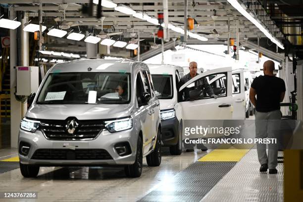 Employees works on assembly line of the Renault Kangoo at the MCA plant in Maubeuge, northern France, on October 6, 2022. - The MCA plant will...