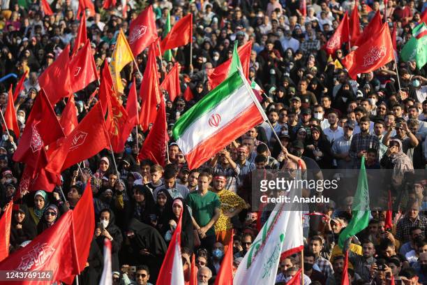 Iranians take part in a pro-government rally and support security forces after protests broke out following the death of Mahsa Amini, a 22-year-old...