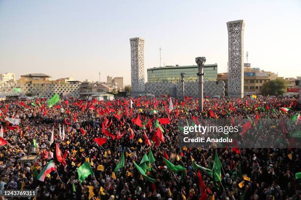 Iranians take part in a pro-government rally and support security forces after protests broke out following the death of Mahsa Amini, a 22-year-old...