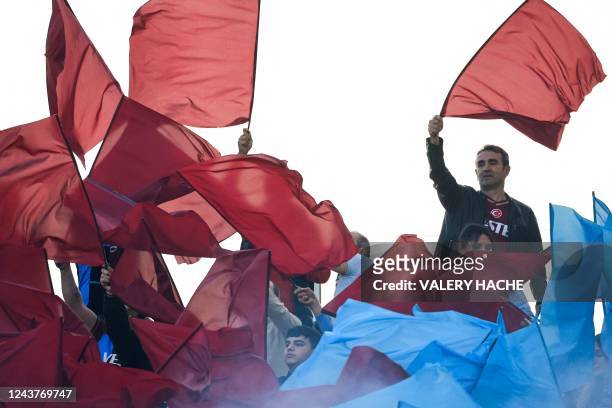 Trabzonspor's supporters wave flags ahead of the UEFA Europa League group H football match between AS Monaco and Trabzonspor at the Louis II Stadium...