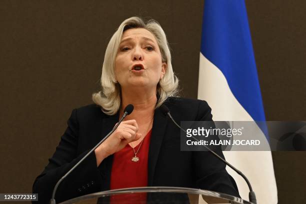 French MP leader and President of the Rassemblement National parliamentary group Marine Le Pen delivers a speech during the symposium "FN/RN...