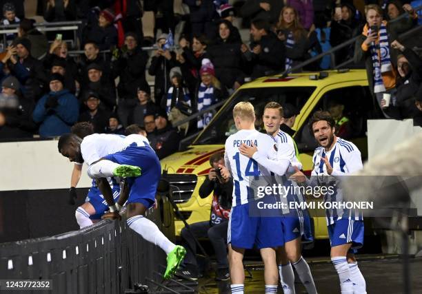 Helsinki's players celebrate outside the pitch after scoring the 1-1 equalizer goal by Helsinki's Finnish midfielder Perparim Hetemaj during the UEFA...