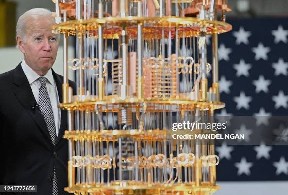 Jos Computer US President Joe Biden looks at a quantum computer as he tours the ...
