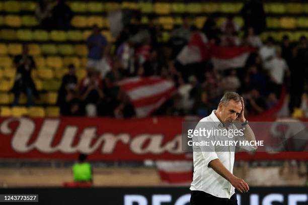 Trabzonspor's Turkish manager Abdullah Avc? reacts at the end of the UEFA Europa League group H football match between AS Monaco and Trabzonspor at...