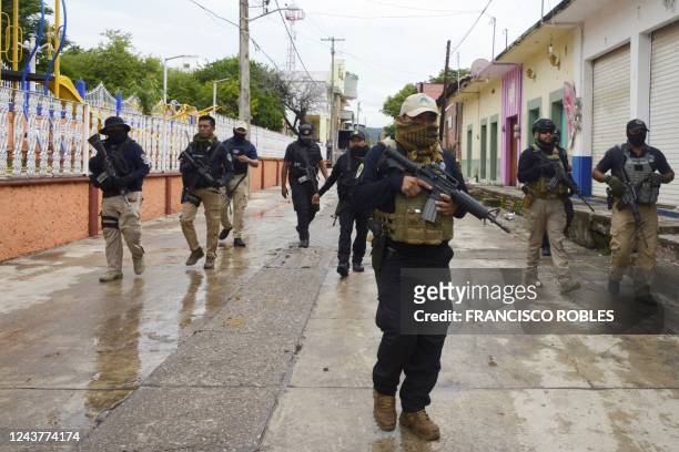 Members of the Federal Police patrol the surroundings of the Municipality of San Miguel Totolapan's building, state of Guerrero, Mexico, on October 6...