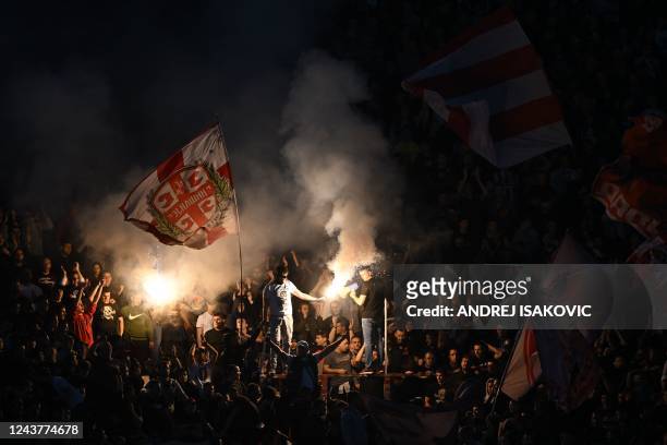 Crvena Zvezdas supporters wave flags and light torches during the UEFA Europa League group H football match between Crvena Zvezda Beograd and...