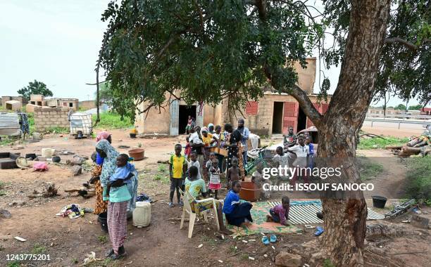 This photograph shows displaced families, who fled Jihadists' attacks in northern and eastern Burkina Faso, in Gampela near Ouagadougou on October 6,...