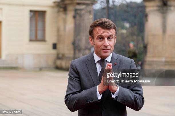 French President Emmanuel Macron adjust his tie at the arrival of the first European Political Community meeting in Prague Castel on October 6, 2022...