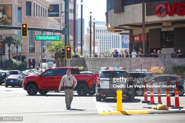 Police at the scene where multiple people were stabbed in front of a Strip casino in Las Vegas, Thursday, Oct. 6, 2022.