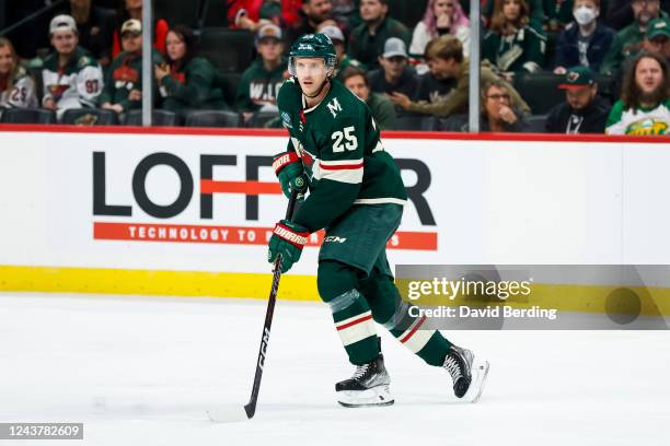 Jonas Brodin of the Minnesota Wild skates with the puck against the Chicago Blackhawks in the third period of a preseason game at Xcel Energy Center...