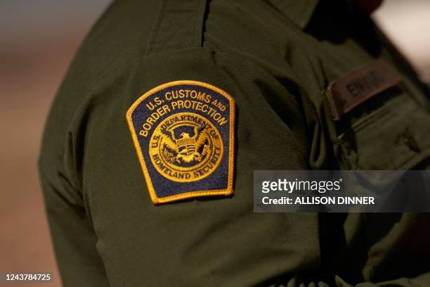 Customs and Border Protection patch is seen on the arm of an agent in the Jacumba mountains on October 6, 2022 in Imperial County, California. - In...