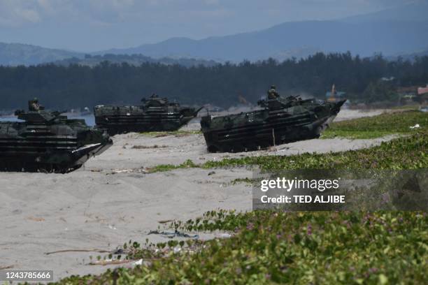 Philippine Marines amphibious assault vehicles roll in during a joint amphibious landing exercise with US marines at a beach facing the South China...