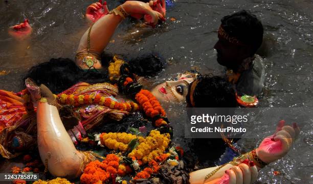 Idol of goddess Durga is seen on the banks of river Kuakhai as it prepares by devotees for immersion on the end of the five days long Durga Puja...