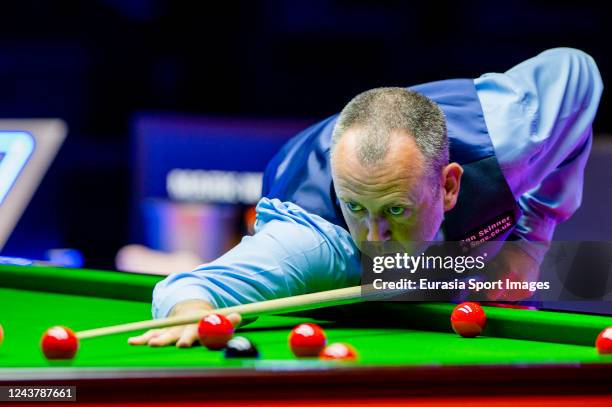 Mark Williams of Wales plays a shot during Hong Kong Masters 2022 Quarter Final match between Neil Robertson of Australia and Mark Williams of Wales...