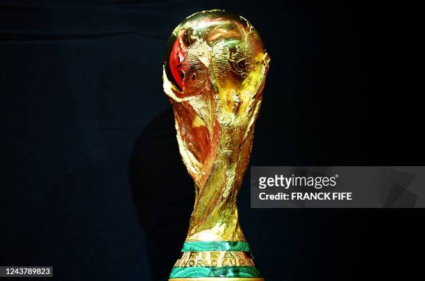 This photograph taken on October 7, 2022 shows the FIFA World Cup trophy displayed during the FIFA World Cup Trophy Tour, in Paris. - The 2022 FIFA...