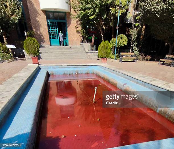 Picture obtained by AFP outside Iran on October 7, 2022 shows a fountain with its water coloured red outside the Artists Forum at Honarmandan Park in...