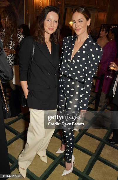 Caitriona Balfe and Michelle Monaghan attend the Academy Of Motion Pictures Arts And Sciences Women In Film Lunch at Claridge's Hotel on October 7,...