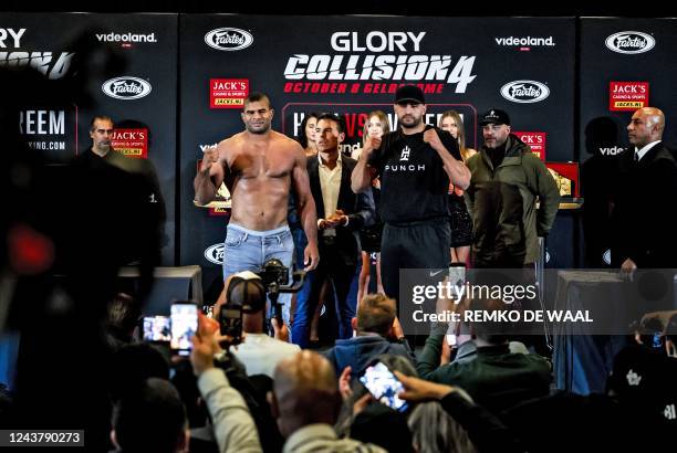Alistair Overeem and Badr Hari pose during the weigh in and staredown on the eve of their kickboxing fight at the Gelredome in Amsterdam, on October...