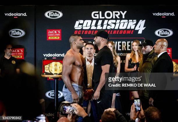 Alistair Overeem and Badr Hari pose during the weigh in and staredown on the eve of their kickboxing fight at the Gelredome in Amsterdam, on October...