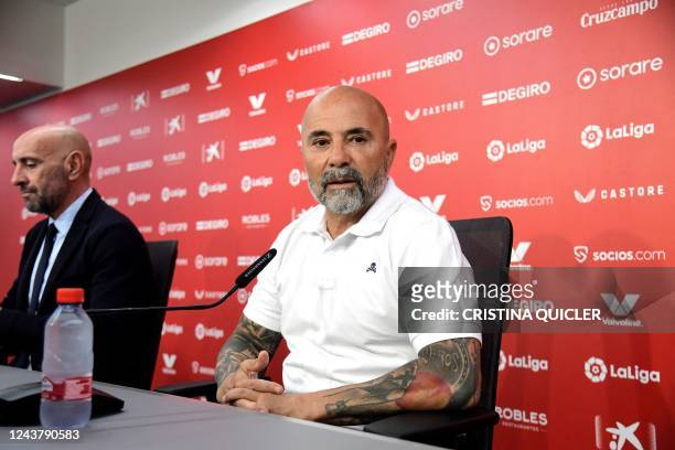 New Sevilla FC coach Jorge Sampaoli arrives flanked by FC Sevilla's Spanish sports director Ramon Rodriguez Verdejo, aka Monchi during his...