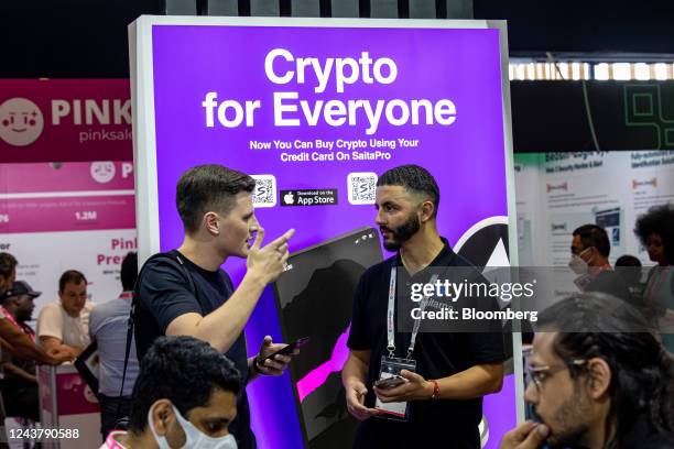 Sign reads 'Crypto For Everyone' on the Saitama token booth during the Dubai Crypto Expo at the Festival Arena in Dubai, United Arab Emirates, on...