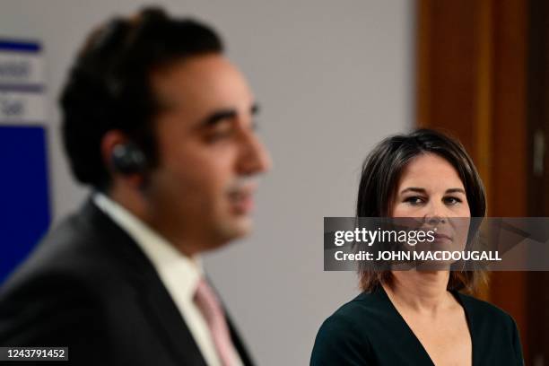 German Foreign Minister Annalena Baerbock listens during a joint press conference with Pakistan's Foreign Minister Bilawal Bhutto Zardari after a...