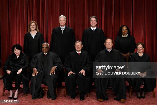 Justices of the US Supreme Court pose for their official photo at the Supreme Court in Washington, DC on October 7, 2022. Associate Justice Sonia...