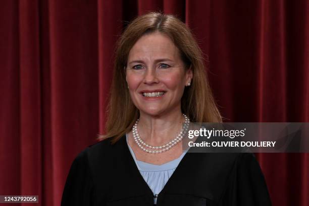 Associate US Supreme Court Justice Amy Coney Barrett poses for the official photo at the Supreme Court in Washington, DC on October 7, 2022.