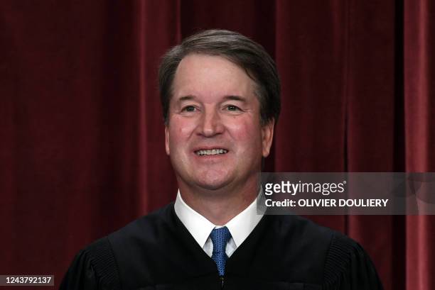 Associate US Supreme Court Justice Brett Kavanaugh poses for the official photo at the Supreme Court in Washington, DC on October 7, 2022.