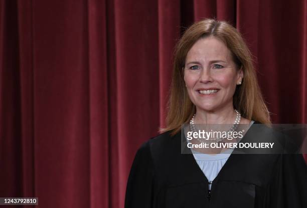 Associate US Supreme Court Justice Amy Coney Barrett poses for the official photo at the Supreme Court in Washington, DC on October 7, 2022.